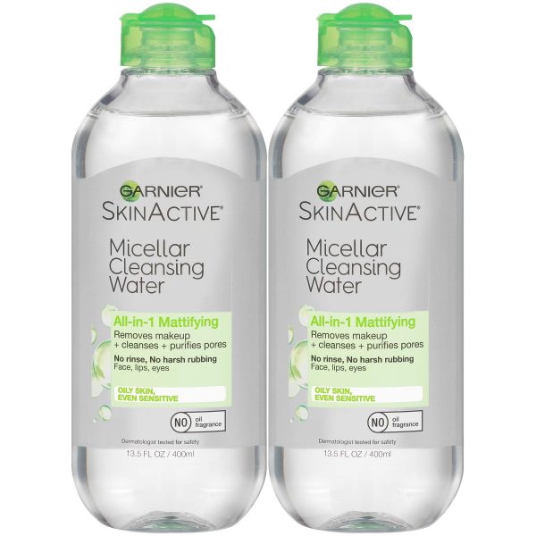 A bottle of Garnier SkinActive Micellar Cleansing Water surrounded by cotton pads, showcasing its gentle yet effective formula for removing makeup and impurities.